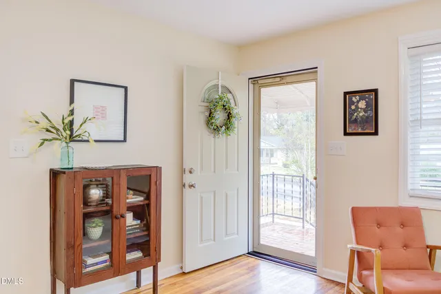 a view of room with window and wooden floor