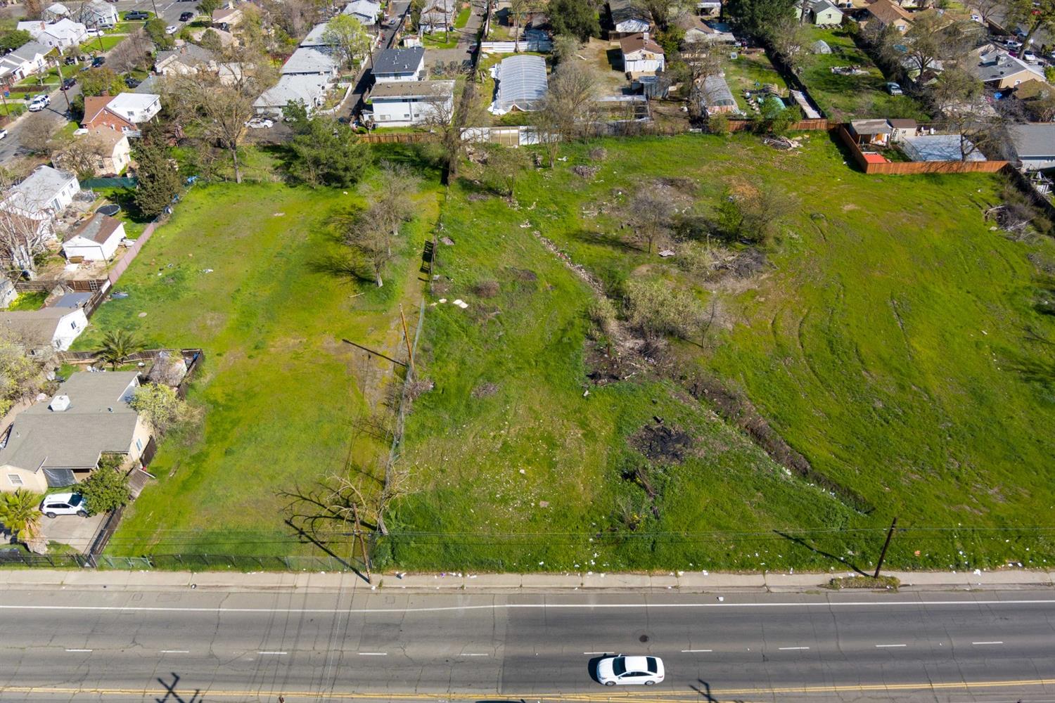 3040 Rio Linda Boulevard Sacramento, CA 95815 - Photo 11 of 19 an aerial view of residential houses with yard