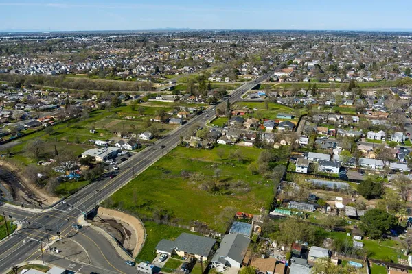 an aerial view of a residential houses with outdoor space