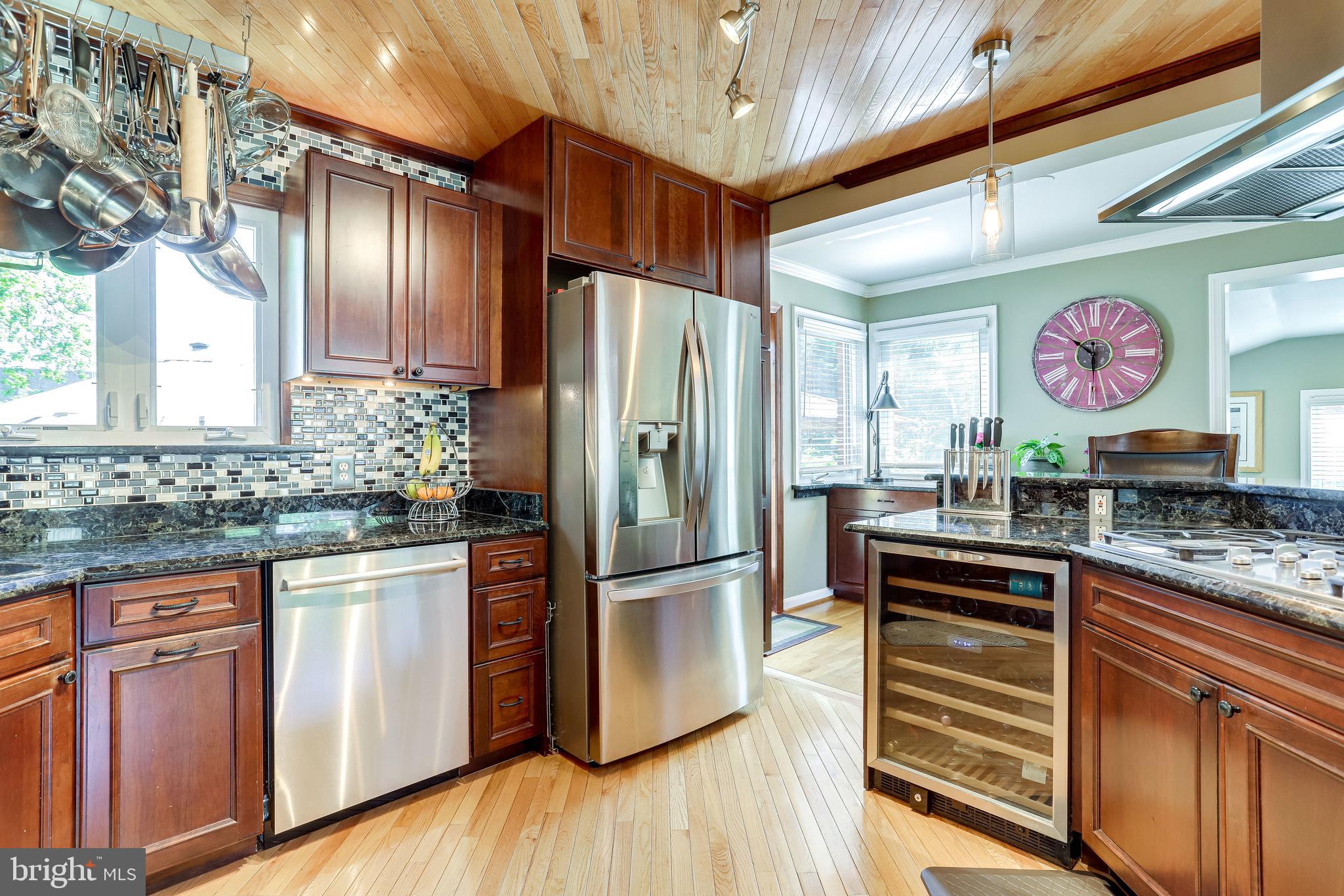 6904 Inverness Drive Springfield, VA 22150 - Photo 11 of 54 Granite Counters, Beverage Storage, Pendant Lights