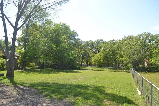 a view of swimming pool with a yard