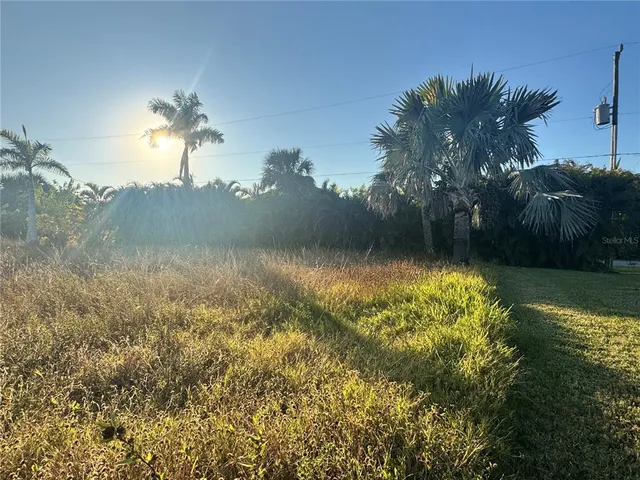 a view of a lake with a yard