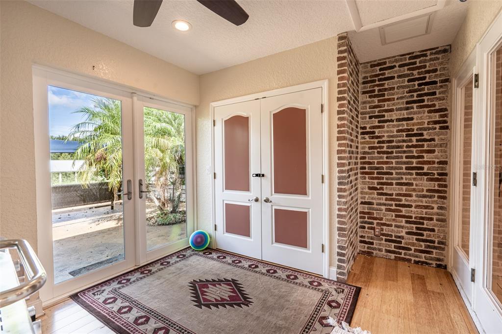 18301 South Obrien Road Groveland, FL 34736 - Photo 12 of 35 a view of a hallway with wooden floor and a fireplace