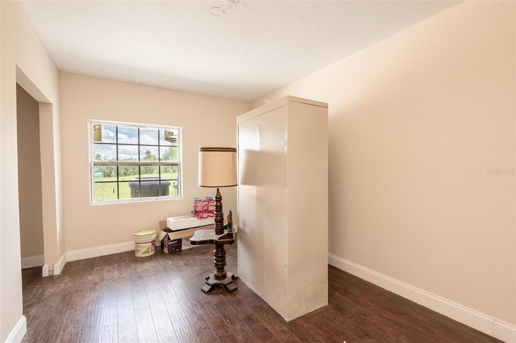 18301 South Obrien Road Groveland, FL 34736 - Photo 14 of 35 a view of a workspace with furniture and a window