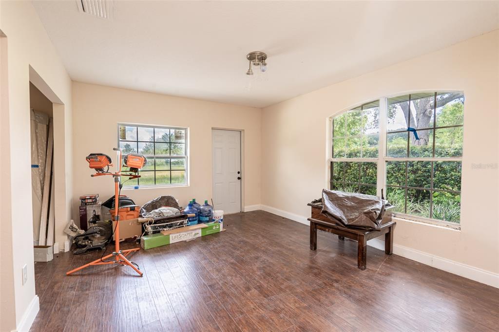 18301 South Obrien Road Groveland, FL 34736 - Photo 16 of 35 a view of a workspace with furniture and a window