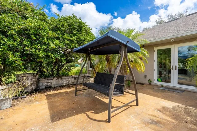 a wooden bench sitting in front of a building