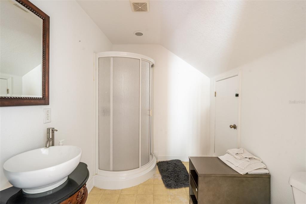 18301 South Obrien Road Groveland, FL 34736 - Photo 28 of 35 a bathroom with a granite countertop sink and a mirror