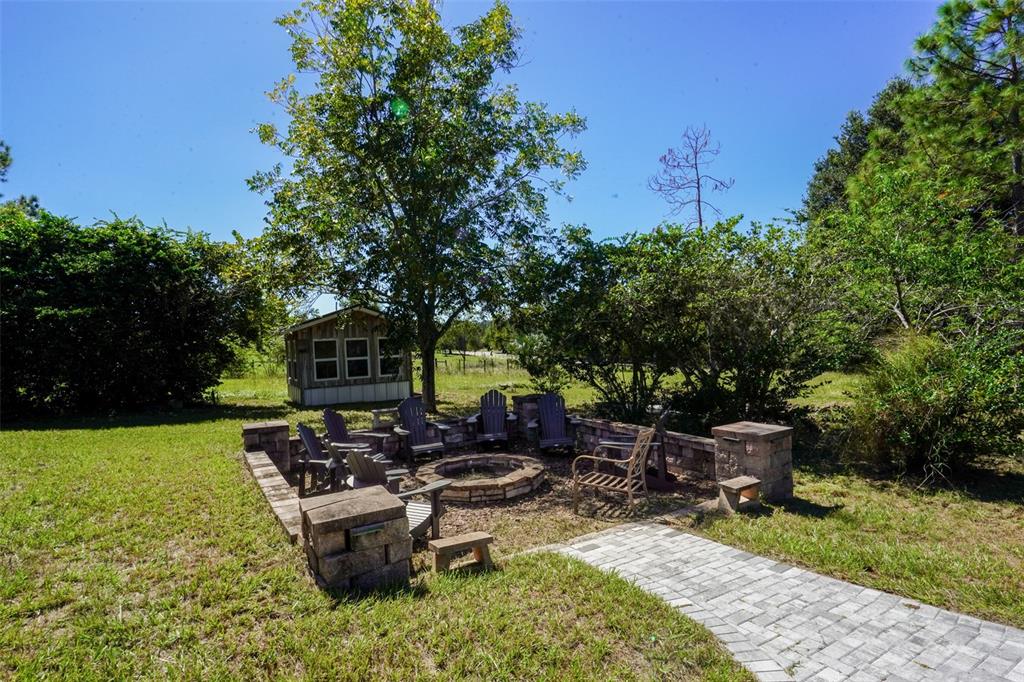 18301 South Obrien Road Groveland, FL 34736 - Photo 5 of 35 a view of a backyard with sitting area