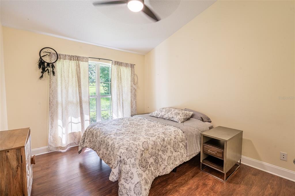 18301 South Obrien Road Groveland, FL 34736 - Photo 9 of 35 a bedroom with a bed and a window