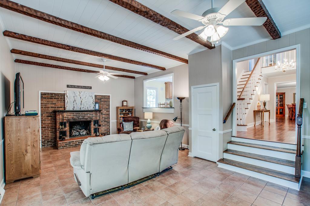 2052 Ridgecrest Circle Dickson, TN 37055 - Photo 7 of 30 Living room with overhead beams & a gas fireplace.