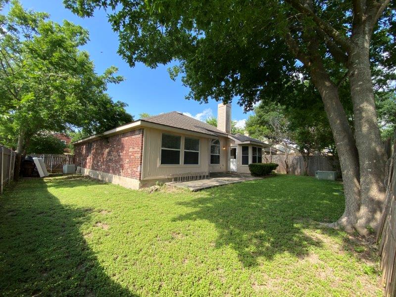 1903 Balsam Way Round Rock, TX 78665 - Photo 19 of 21 A generous backyard offers a private outdoor sanctuary, bordered by mature trees and a sturdy fence.