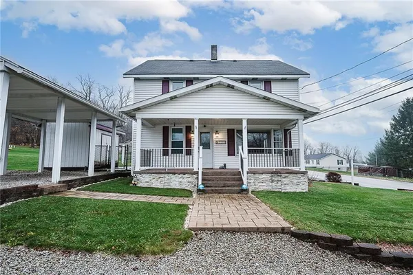 a front view of a house with a yard