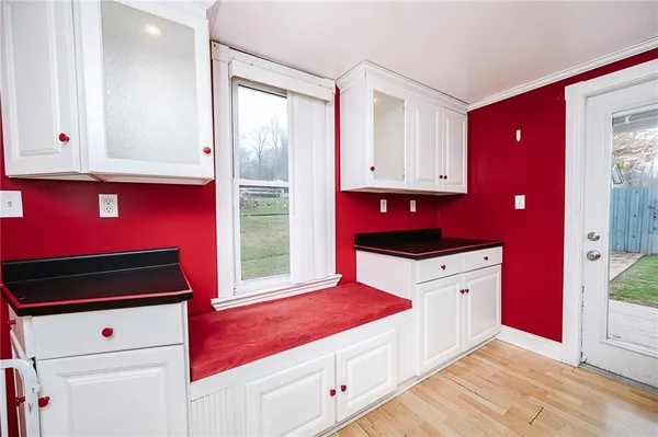 a kitchen with stainless steel appliances cabinets and a table