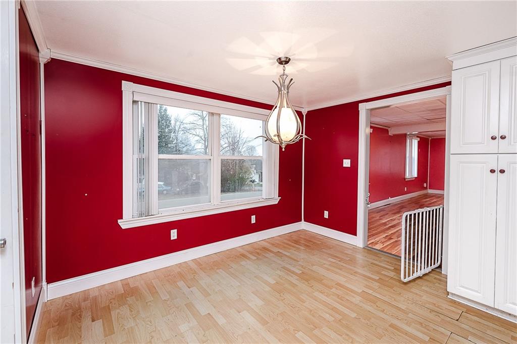 228 Harrison Avenue Robinson, PA 15949 - Photo 16 of 46 a view of an empty room with a window and a chandelier