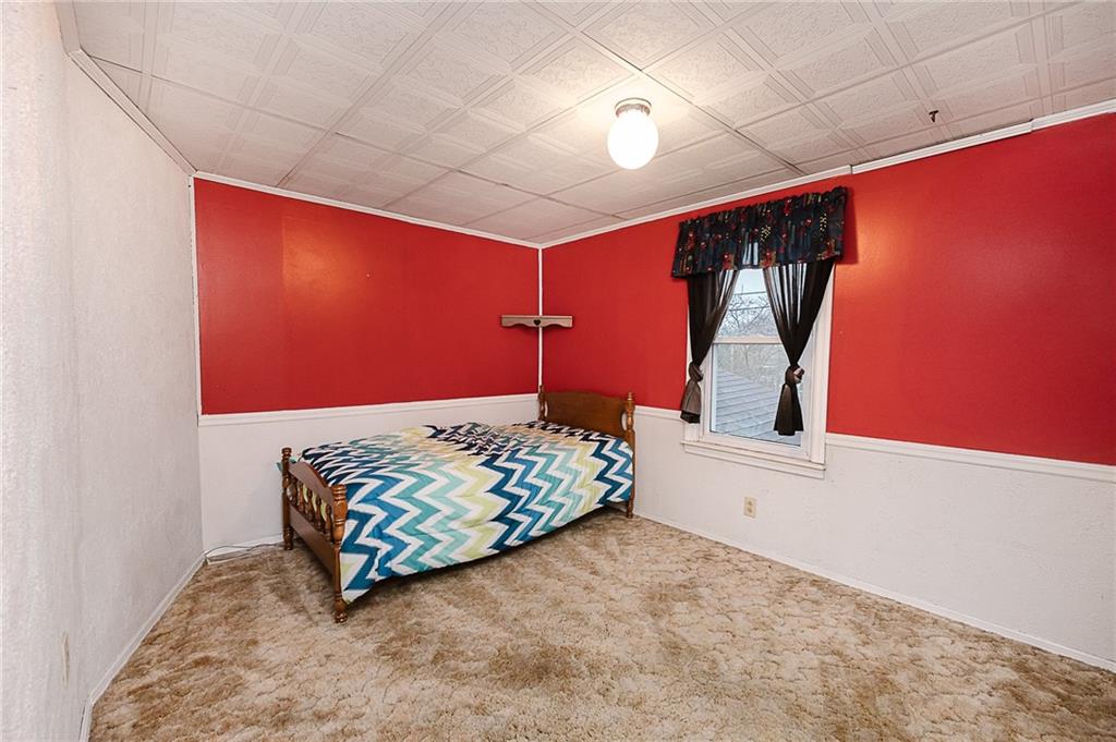 228 Harrison Avenue Robinson, PA 15949 - Photo 17 of 46 a bedroom with a bed and a dresser