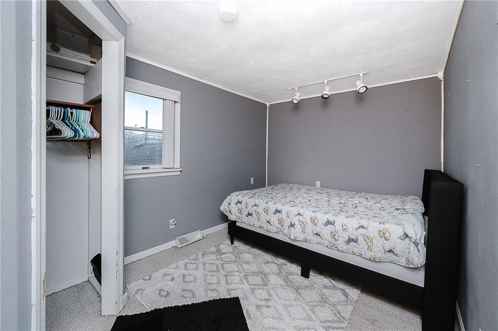 228 Harrison Avenue Robinson, PA 15949 - Photo 19 of 46 a bedroom with a bed and a window