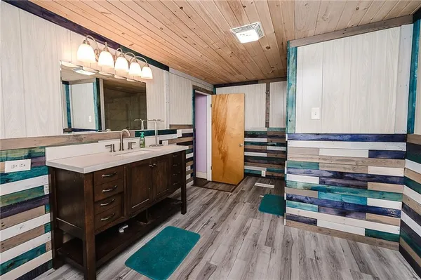 a kitchen with a sink and cabinets