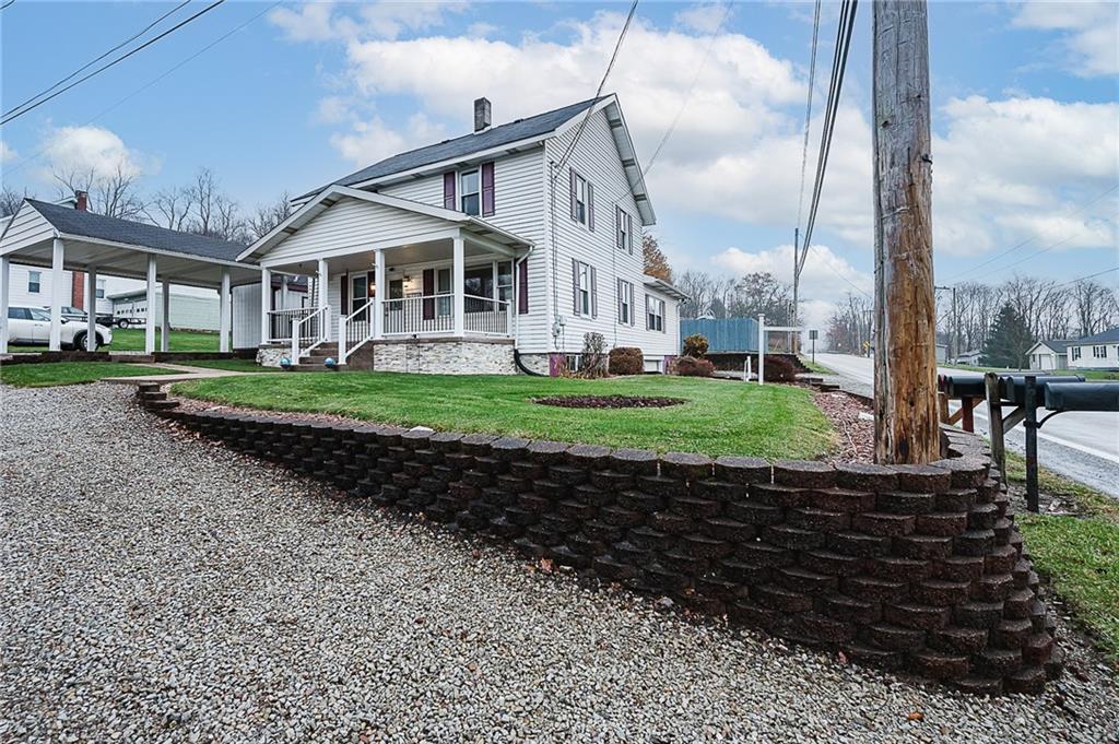 228 Harrison Avenue Robinson, PA 15949 - Photo 4 of 46 a front view of a house with a yard