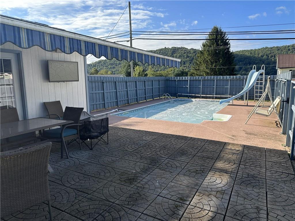 228 Harrison Avenue Robinson, PA 15949 - Photo 43 of 46 a view of a backyard with furniture and iron fence
