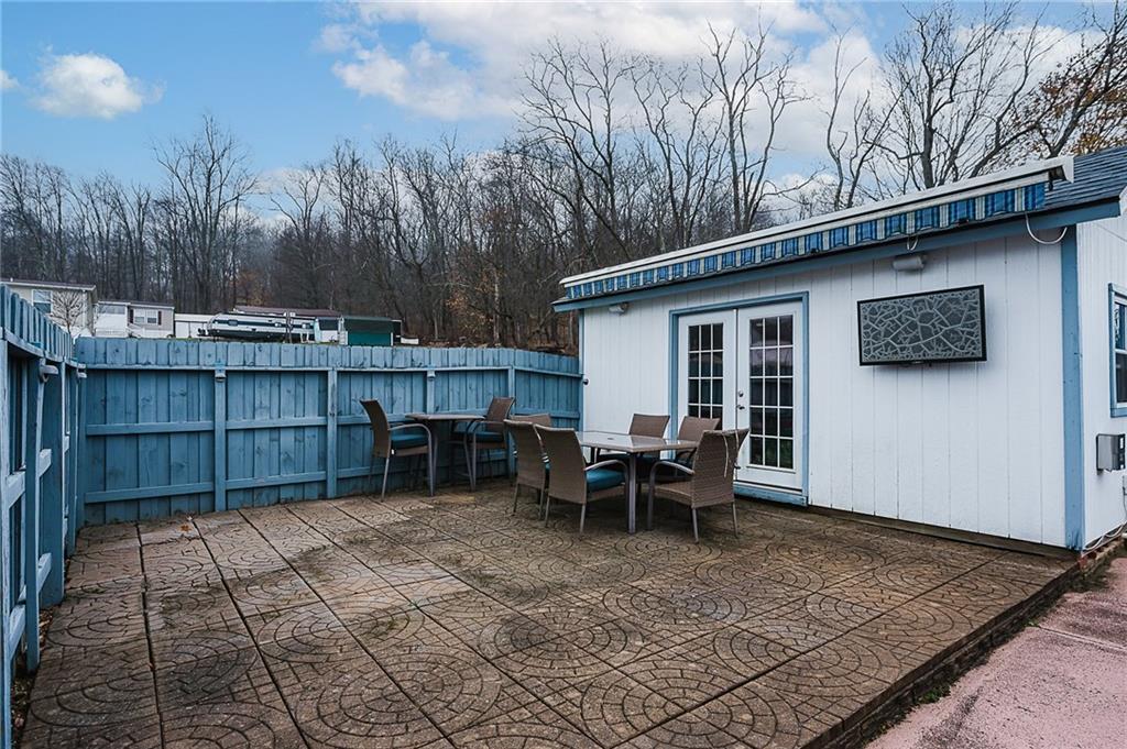 228 Harrison Avenue Robinson, PA 15949 - Photo 44 of 46 a backyard of a house with yard and outdoor seating