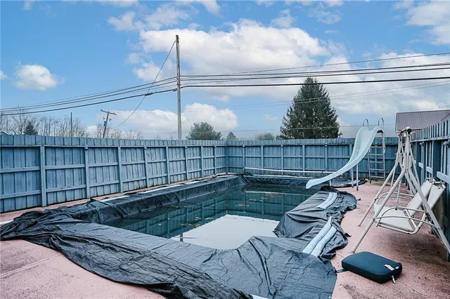 a view of a balcony with furniture