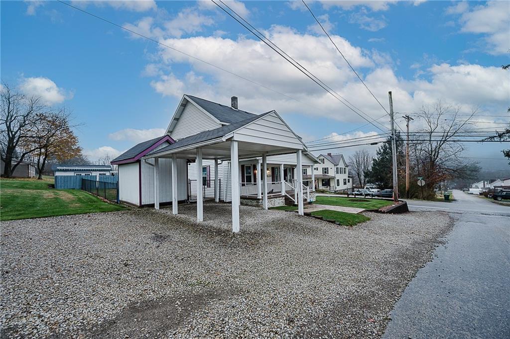 228 Harrison Avenue Robinson, PA 15949 - Photo 9 of 46 a view of a house with a yard and sitting area