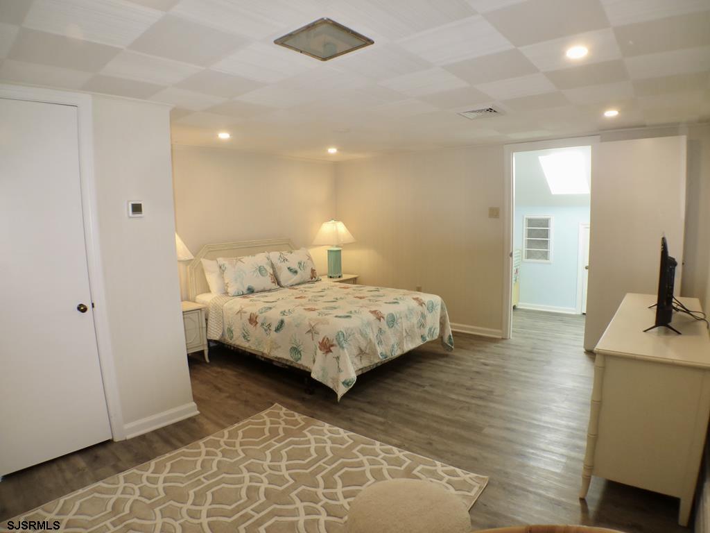 814 Wesley Road Ocean City, NJ 08226 - Photo 26 of 29 a bedroom with a bed and a sink