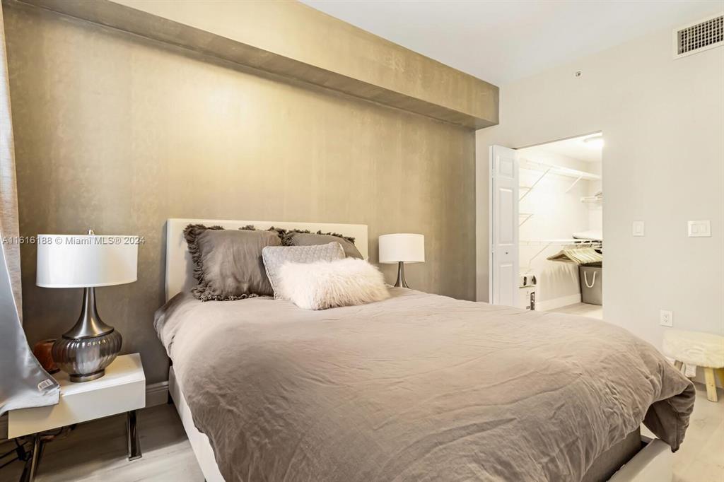 533 Northeast 3rd Avenue, Unit 229 Fort Lauderdale, FL 33301 - Photo 14 of 24 a bedroom with a bed and a lamp on table