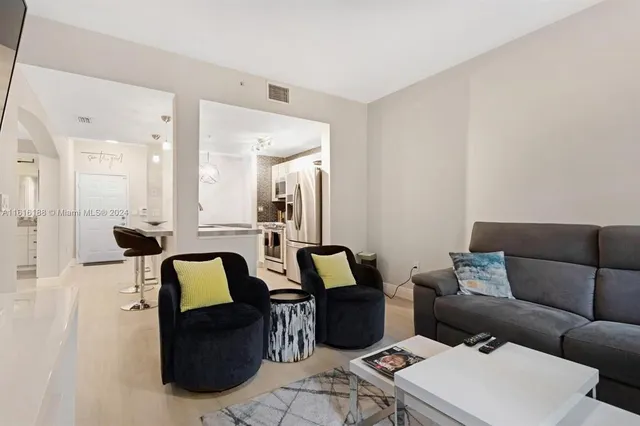 a living room with furniture and a table