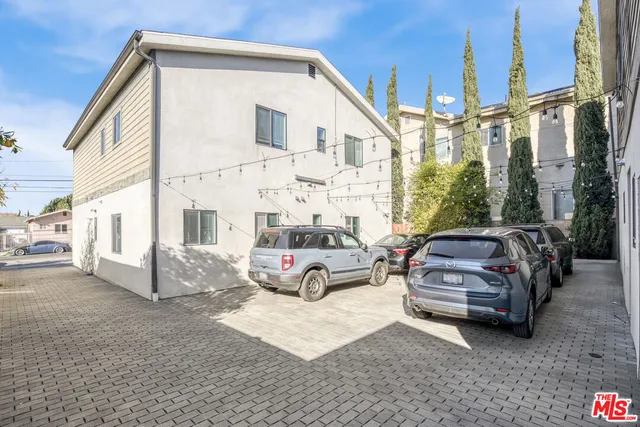 a view of a car park in front of house
