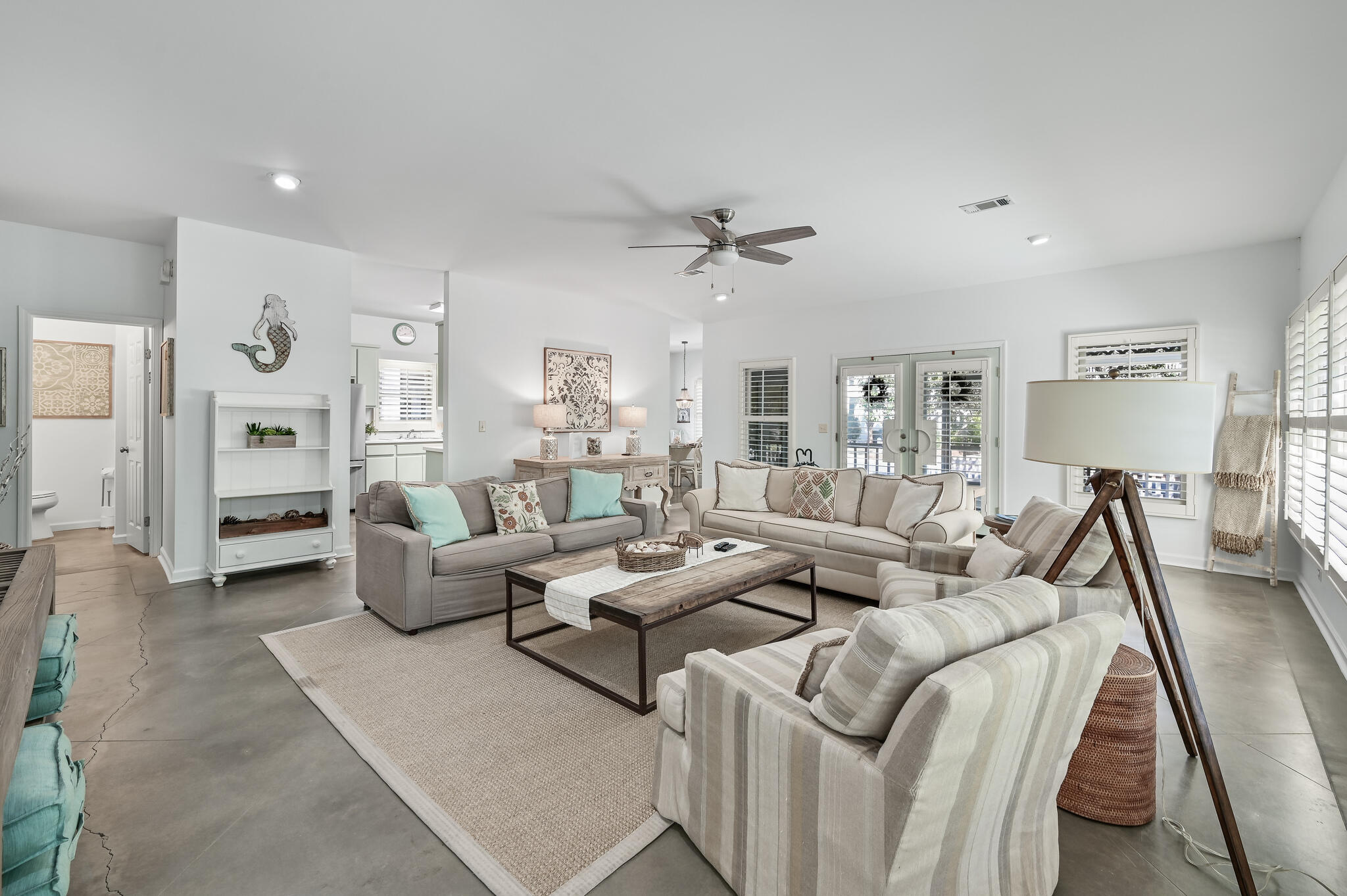65 Cassine Way Santa Rosa Beach, FL 32459 - Photo 11 of 38 a living room with furniture and a chandelier