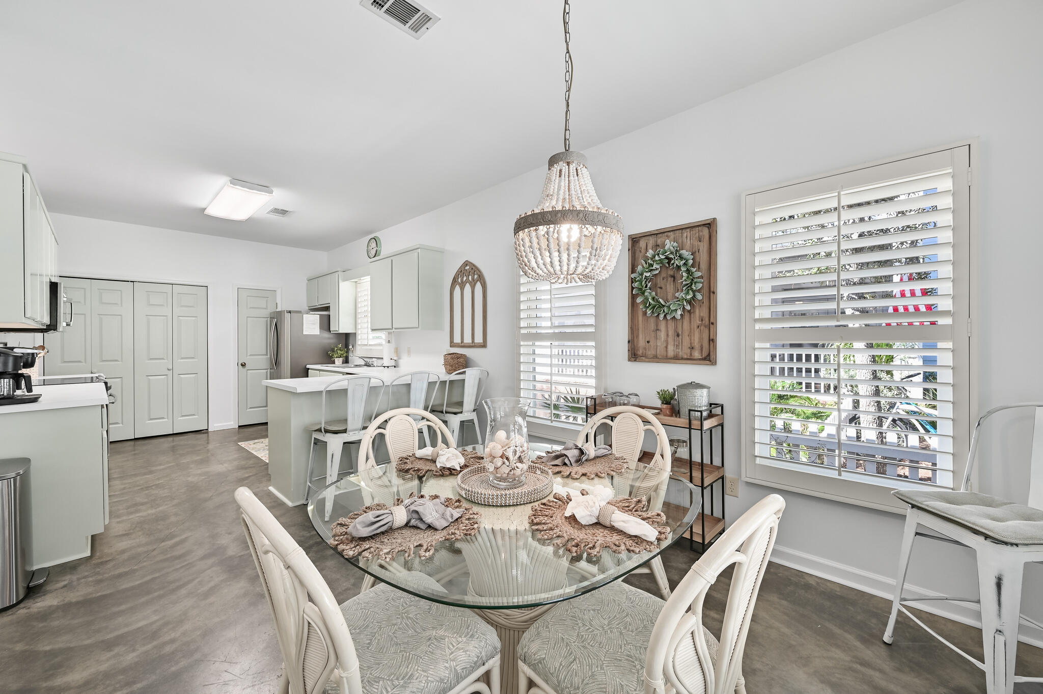 65 Cassine Way Santa Rosa Beach, FL 32459 - Photo 38 of 38 a view of a dining room with furniture window and wooden floor