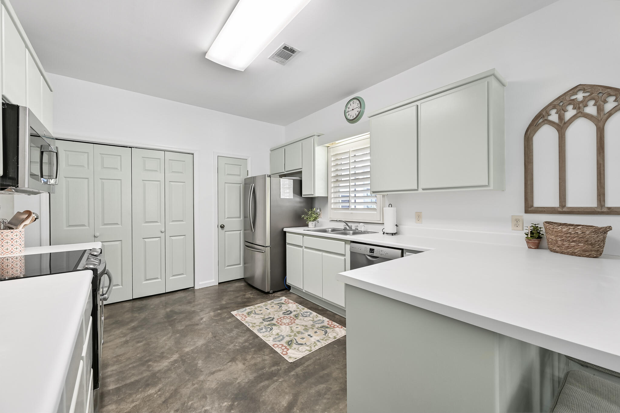 65 Cassine Way Santa Rosa Beach, FL 32459 - Photo 19 of 38 a kitchen with stainless steel appliances a refrigerator sink and cabinets