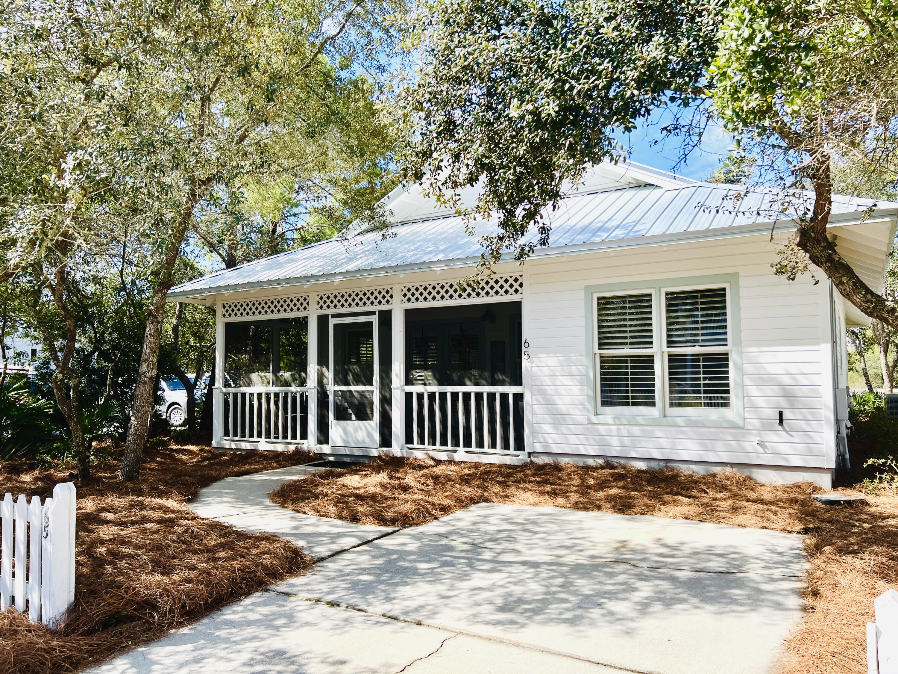 65 Cassine Way Santa Rosa Beach, FL 32459 - Photo 2 of 38 a view of a house with a garden