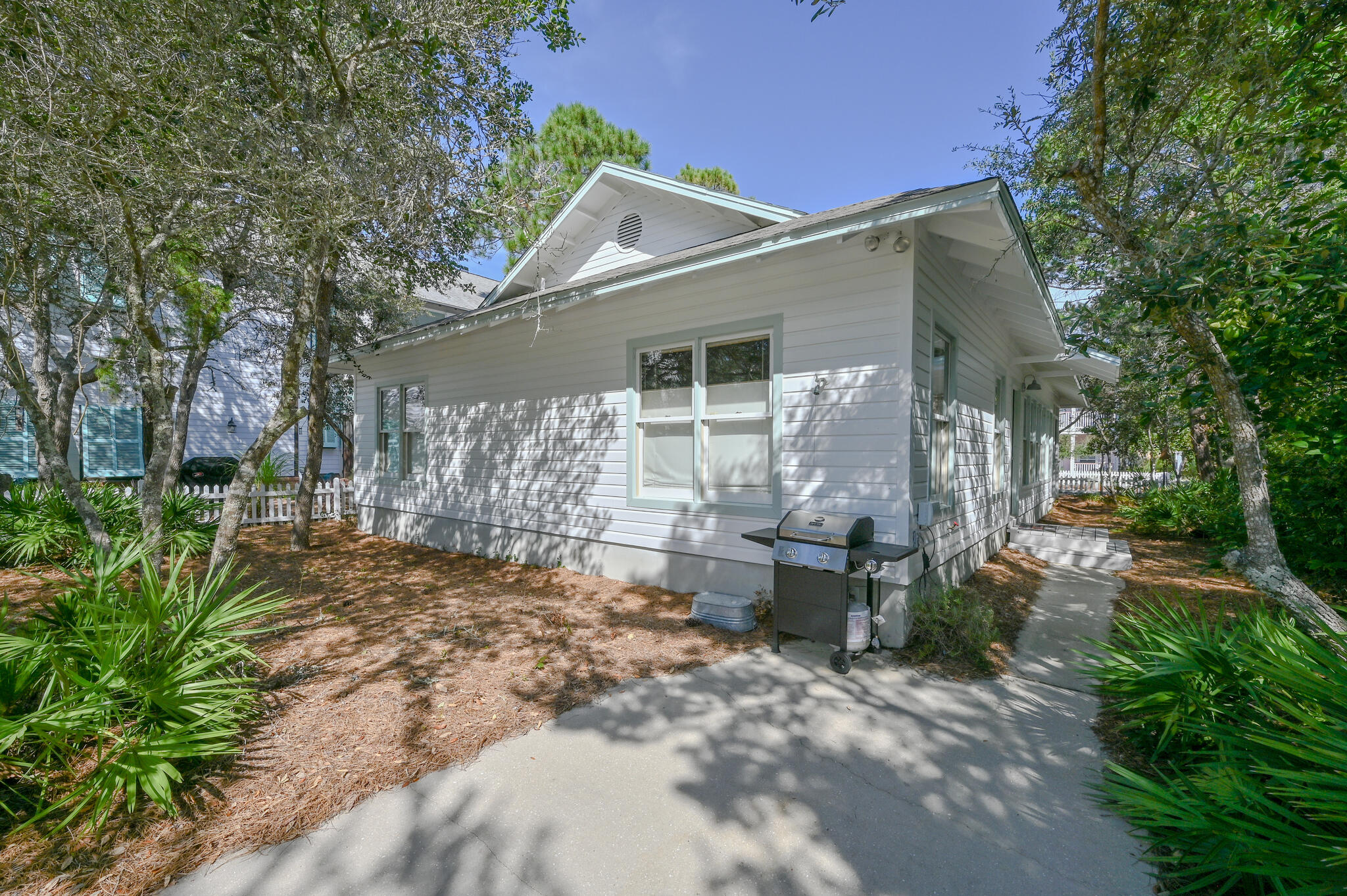 65 Cassine Way Santa Rosa Beach, FL 32459 - Photo 27 of 38 a view of a patio with chairs and potted plants
