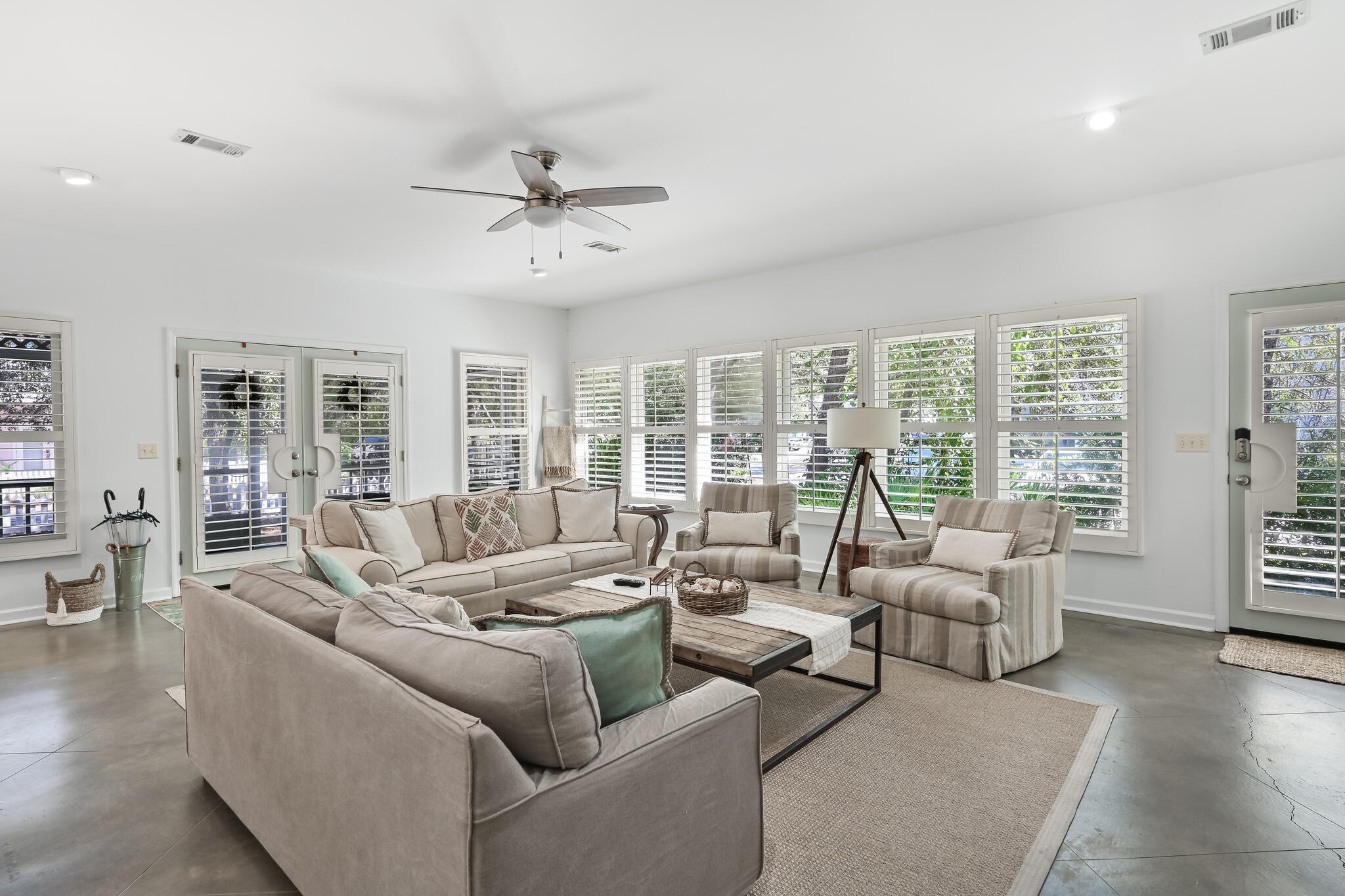 65 Cassine Way Santa Rosa Beach, FL 32459 - Photo 9 of 38 a living room with furniture and large windows