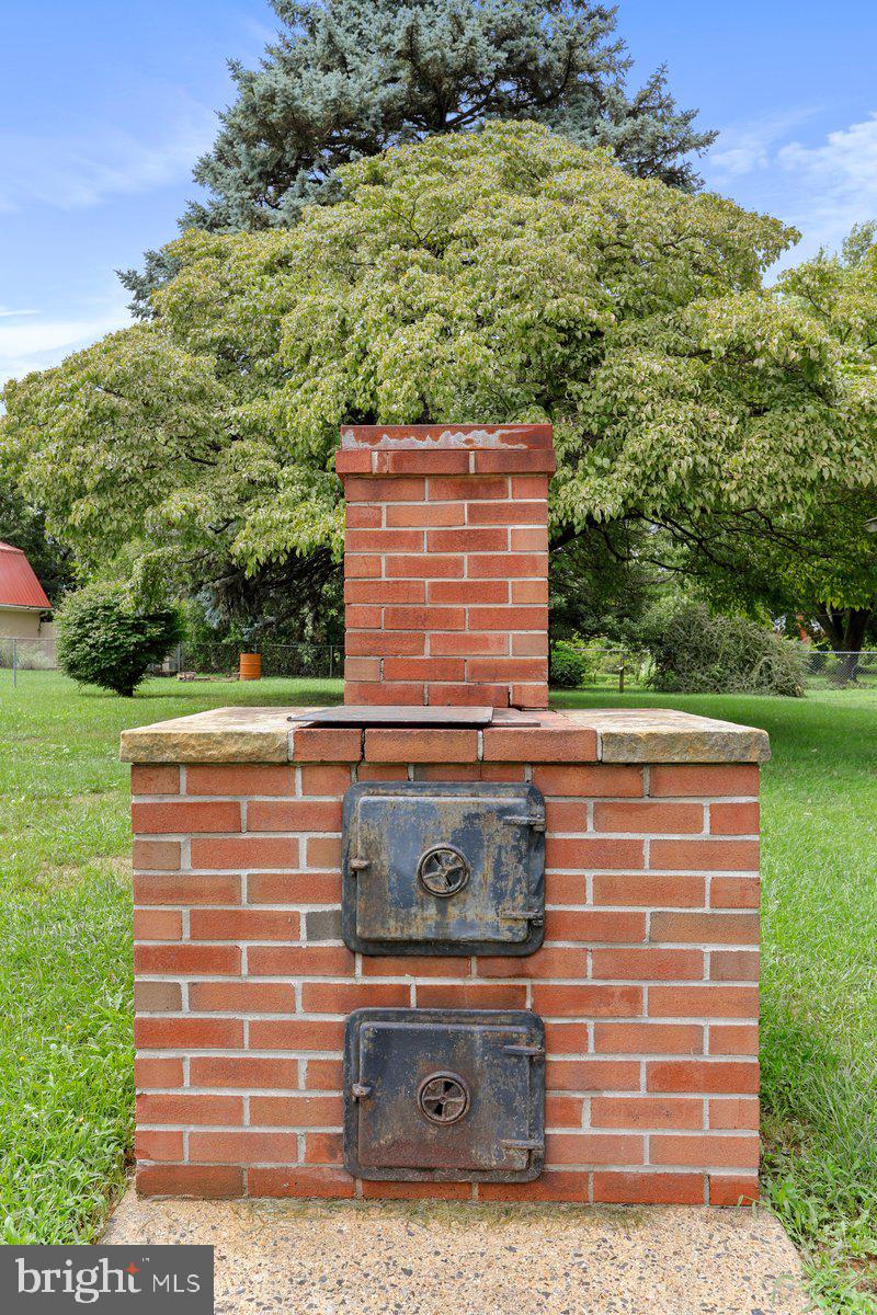 13506 Spriggs Road Hagerstown, MD 21742 - Photo 43 of 43 Back Yard Fireplace