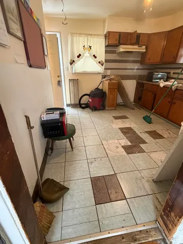 a kitchen with stainless steel appliances kitchen island granite countertop a sink and cabinets