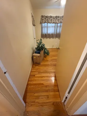 a view of staircase with wooden floor