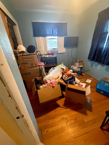 a bed room with furniture and a window