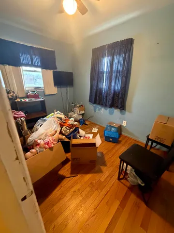 a bedroom with a bed and a chair