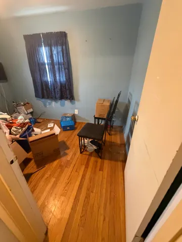 a bed sitting in a chair next to a window