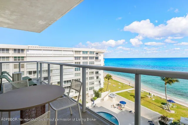 a bathroom with a granite countertop sink a toilet a mirror and shower