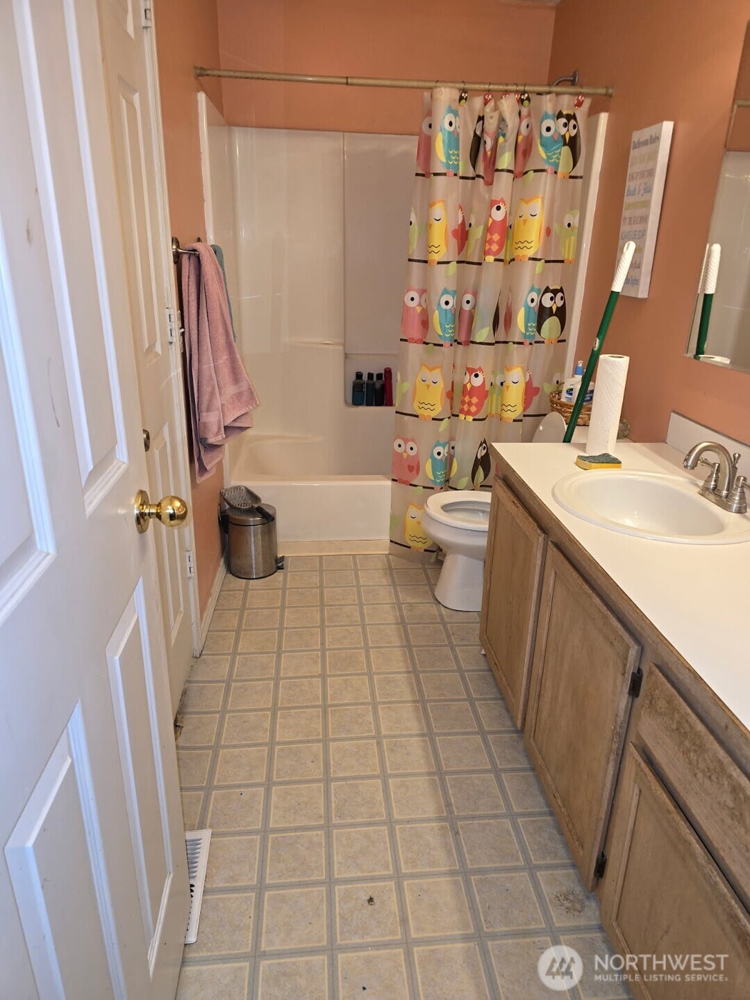 1908 Mulberry Lane Wenatchee, WA 98801 - Photo 3 of 7 a bathroom with a sink a toilet a mirror and shower
