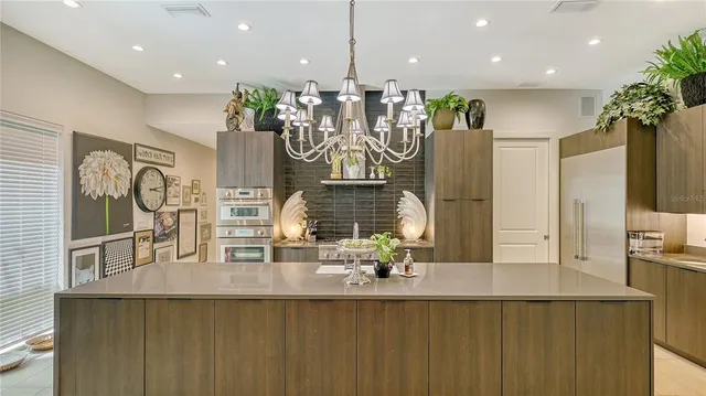 a view of a livingroom with wooden floor and a flat screen tv