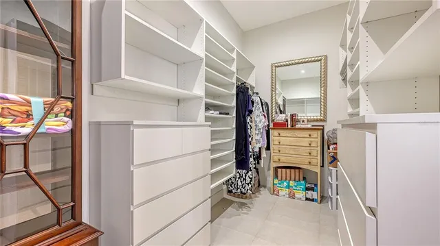 a view of a chairs and table in backyard of the house