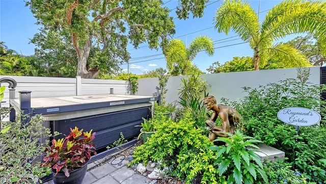 a view of a house with a yard and sitting area