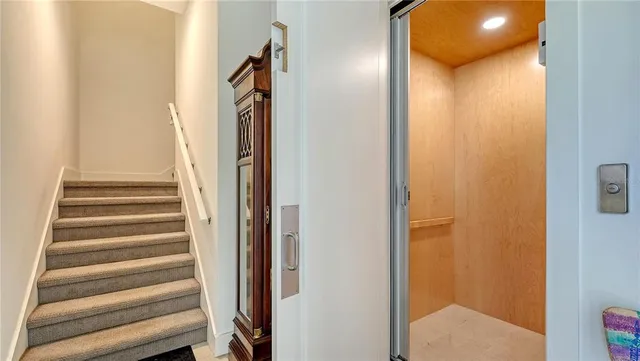 a view of a lake with a house in the background