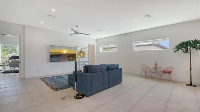 a street sign on a sidewalk next to a road