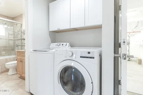 a utility room with dryer and washer